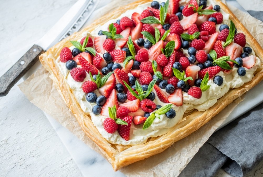 This tart is a perennial crowd pleaser, with a flaky butter puff pastry base topped off with lashings of rich cream and tangy berries. It’s the perfect light dessert to serve after a large Christmas dinner, and it’s so mouth-wateringly delicious, your family will beg you to make it time and time again!