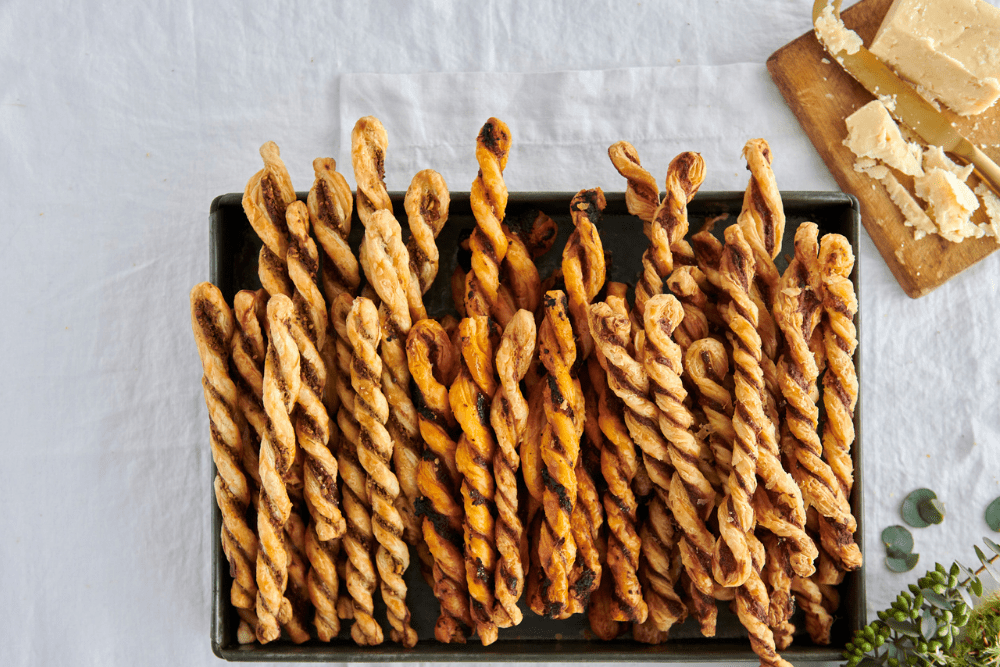 These decadent puff pastry straws are the perfect accompaniment to celebratory drinks or a casual Saturday afternoon charcuterie board (or both). Choose from cheddar and mustard, feta and mint, or arribiata and basil fillings, or go crazy and make them all – we assure you they’ll be gobbled up by peckish family and friends! These straws are also great placed into an airtight jar to be given as gifts.